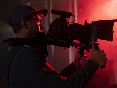 man-filming-with-professional-camera